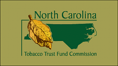 Logo of the North Carolina Tobacco Trust Fund Commission featuring a tobacco leaf overlaid on a green outline of North Carolina on a beige background.